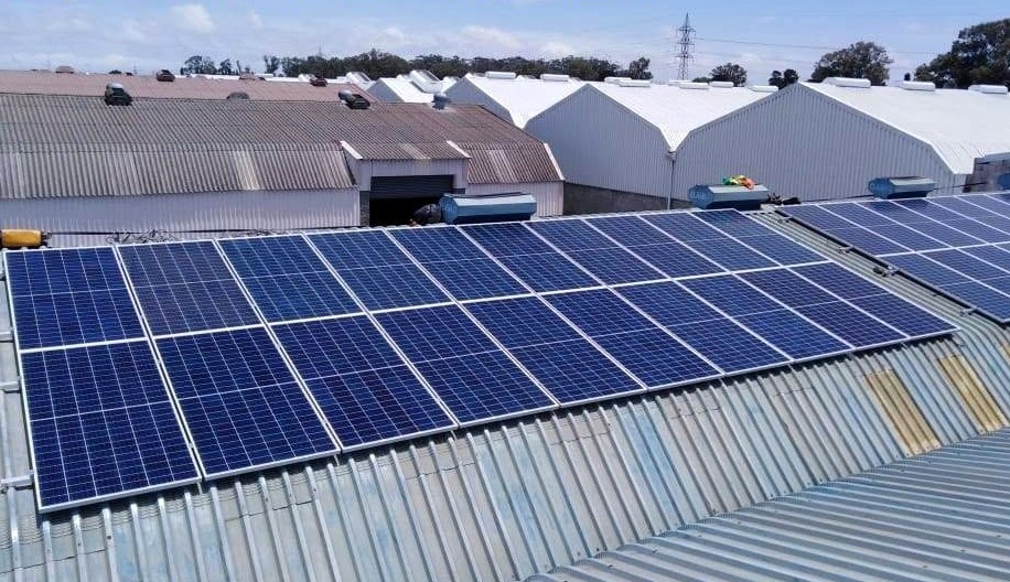 Industrial commercial solar array on corrugated warehouse roof